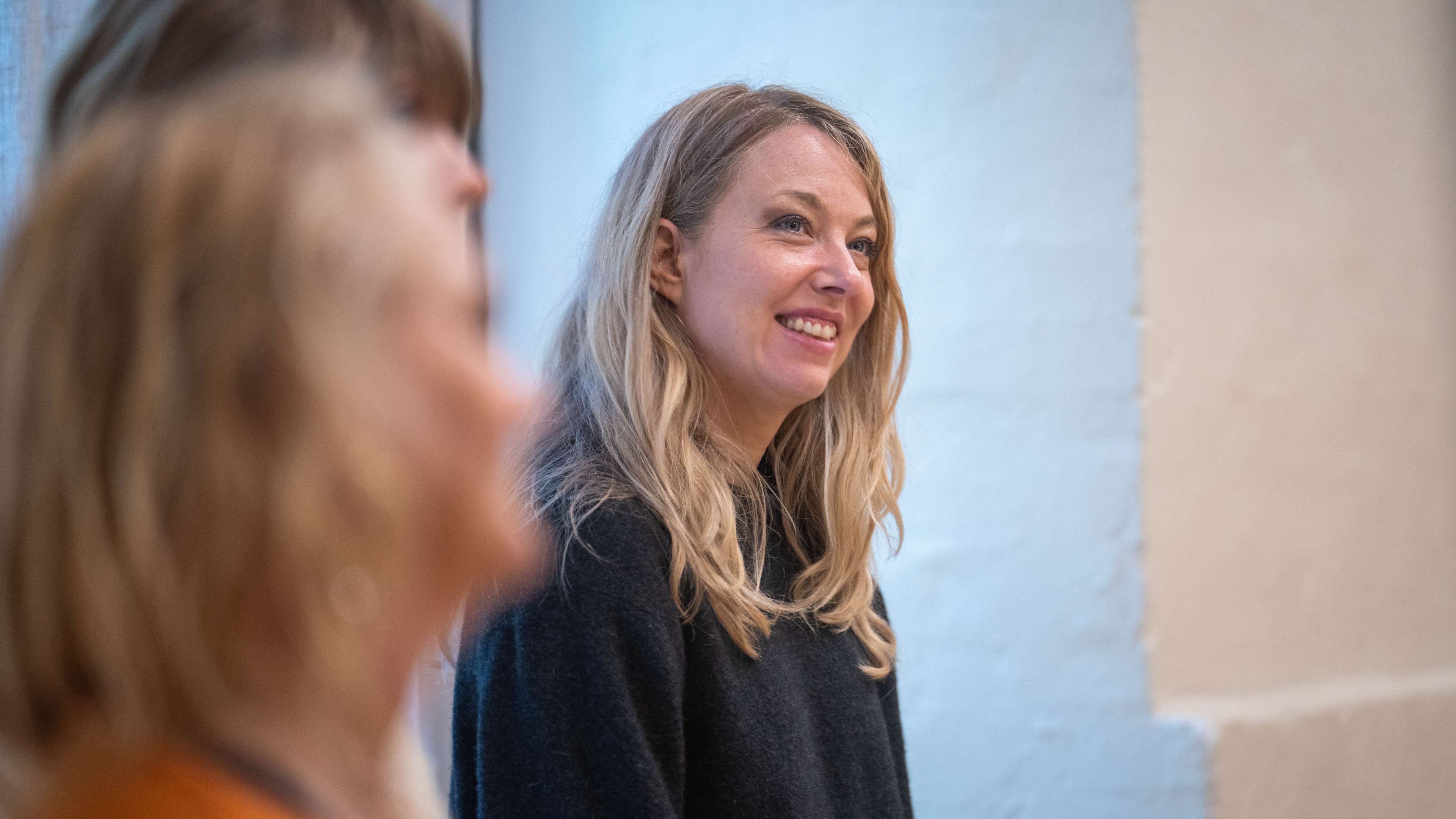 Course participant smiling in a relaxed moment